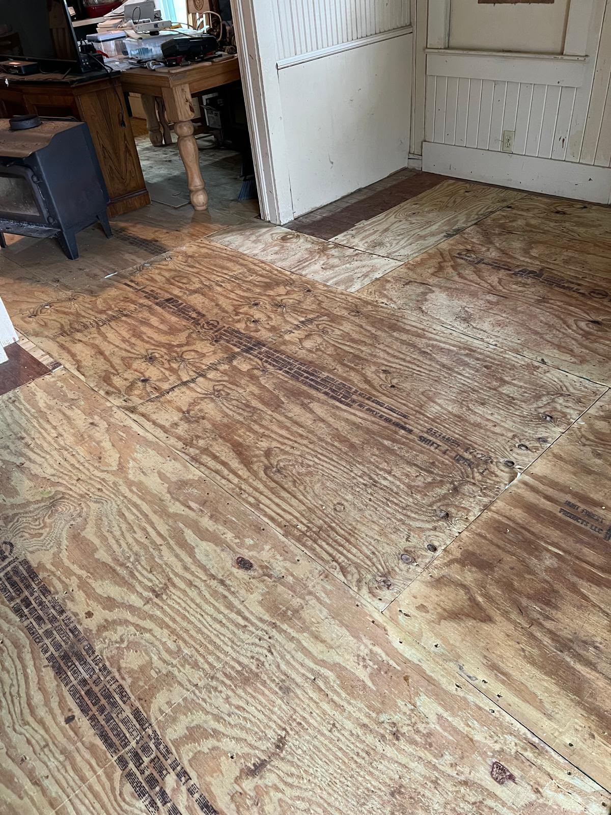 Subfloor after damaged boards were replaced with plywood