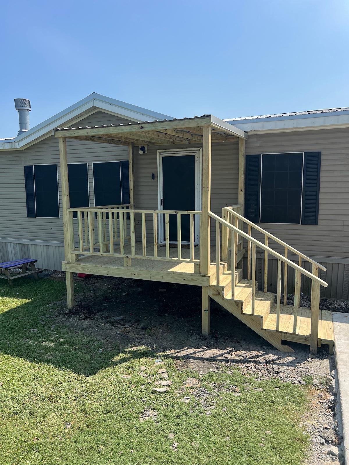 Newly built covered porch and steps at a mobile home