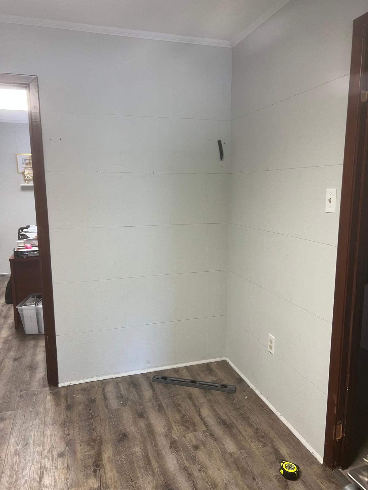 Empty room corner before custom shelves were built
